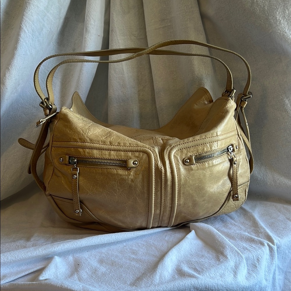 Tan Hobo Bag with Double Straps features soft like material.